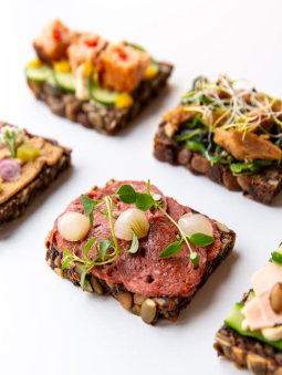 A group of open-faced sandwiches with different toppings