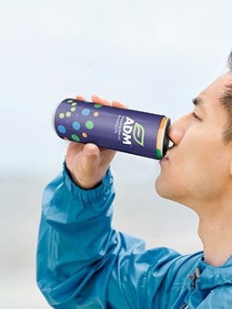 person drinking adm energy drink