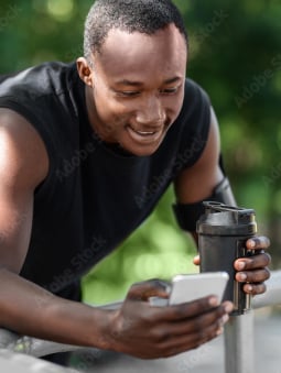 proactive personalization Healthy Men looking at his phone 