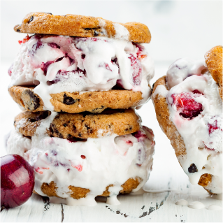 A close shot of homemade looking reduced sugar ice cream cookie sandwhiches.