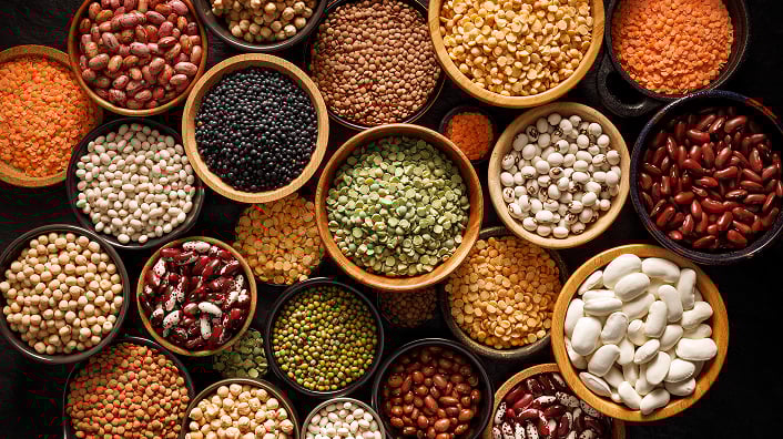 A group of bowls of different types of beans