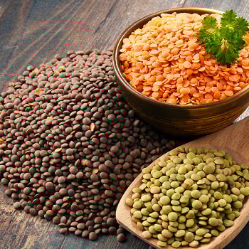 A bowl of lentils and a pile of beans