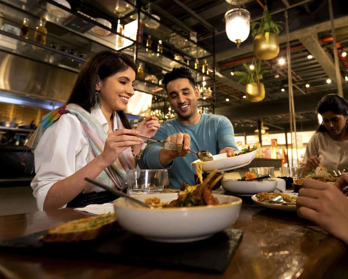 Man and woman sharing food at a restaurant